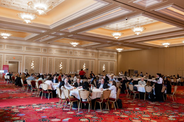The general session ballroom at Encore Boston Harbor, set in rounds