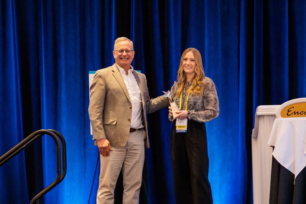 An honoree receiving her award on stage