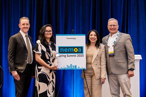Honorees beside the NEMOA Spring Summit sign
