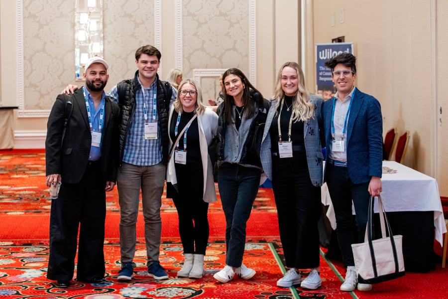 A group of attendees together in the exhibit area