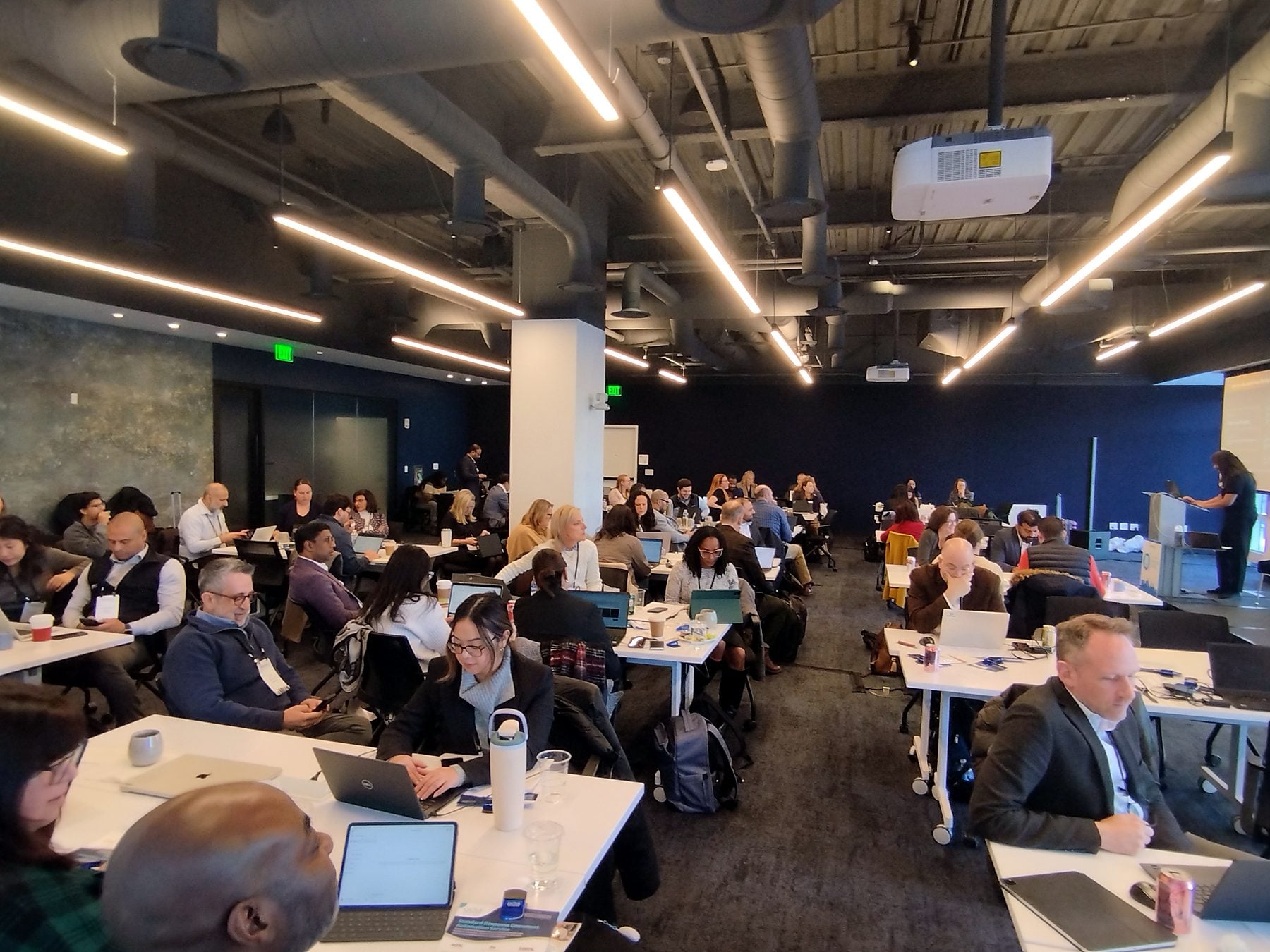 Attendees at work during a session in 2026
