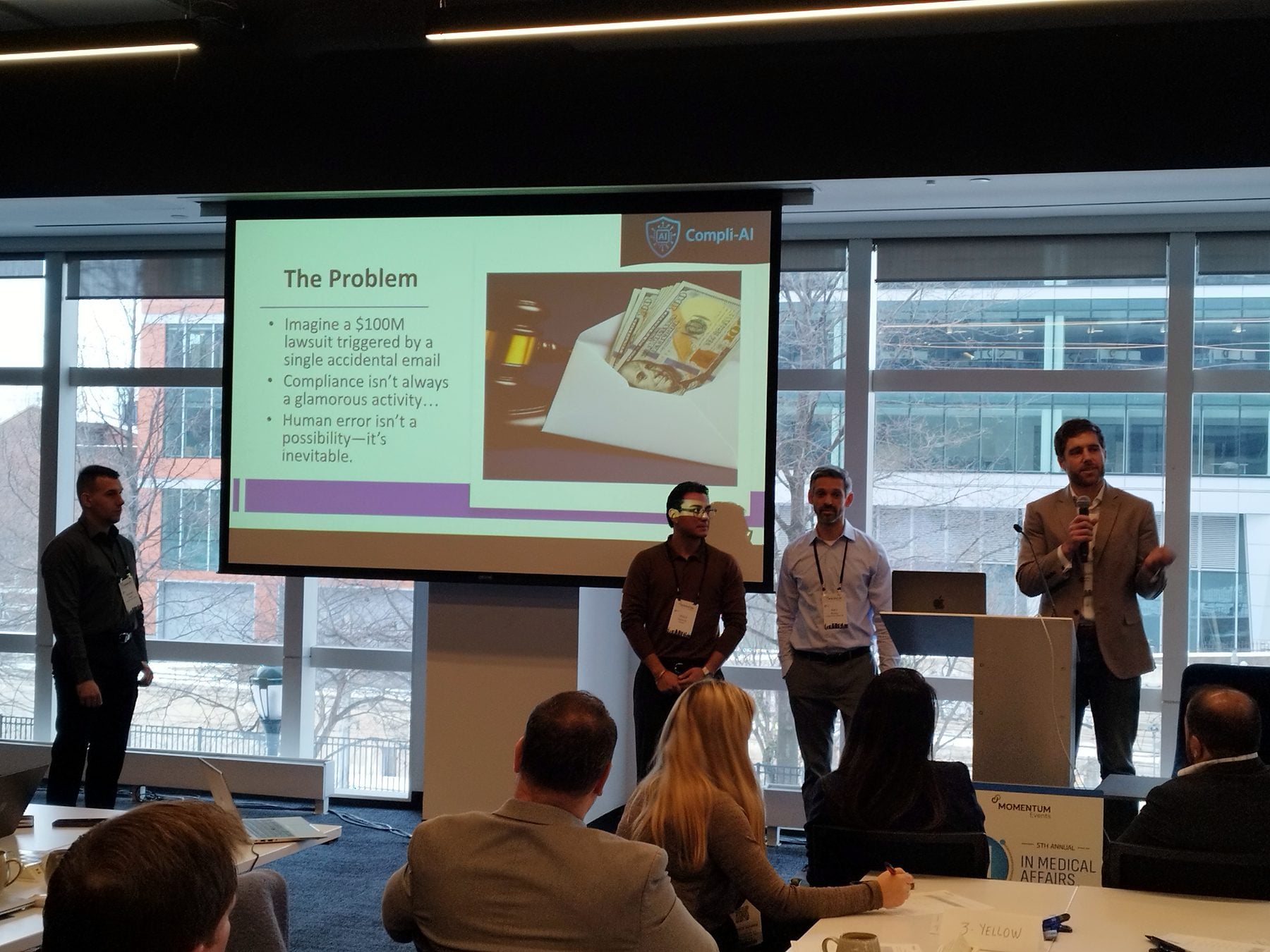 A Shark Tank team pitching an AI solution at the 2026 summit