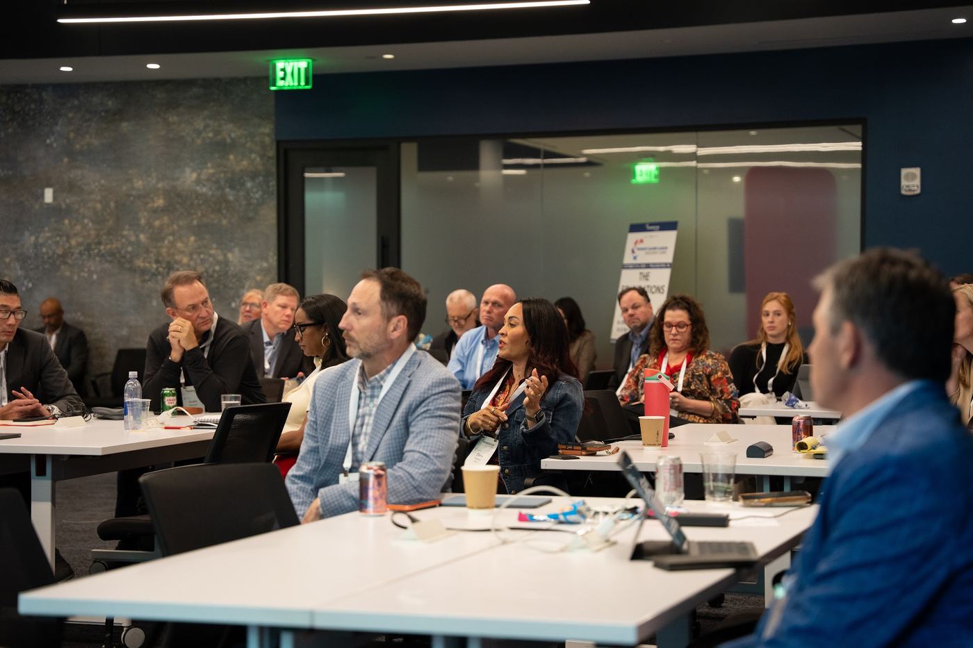 Attendees engaged in a general session at Convene