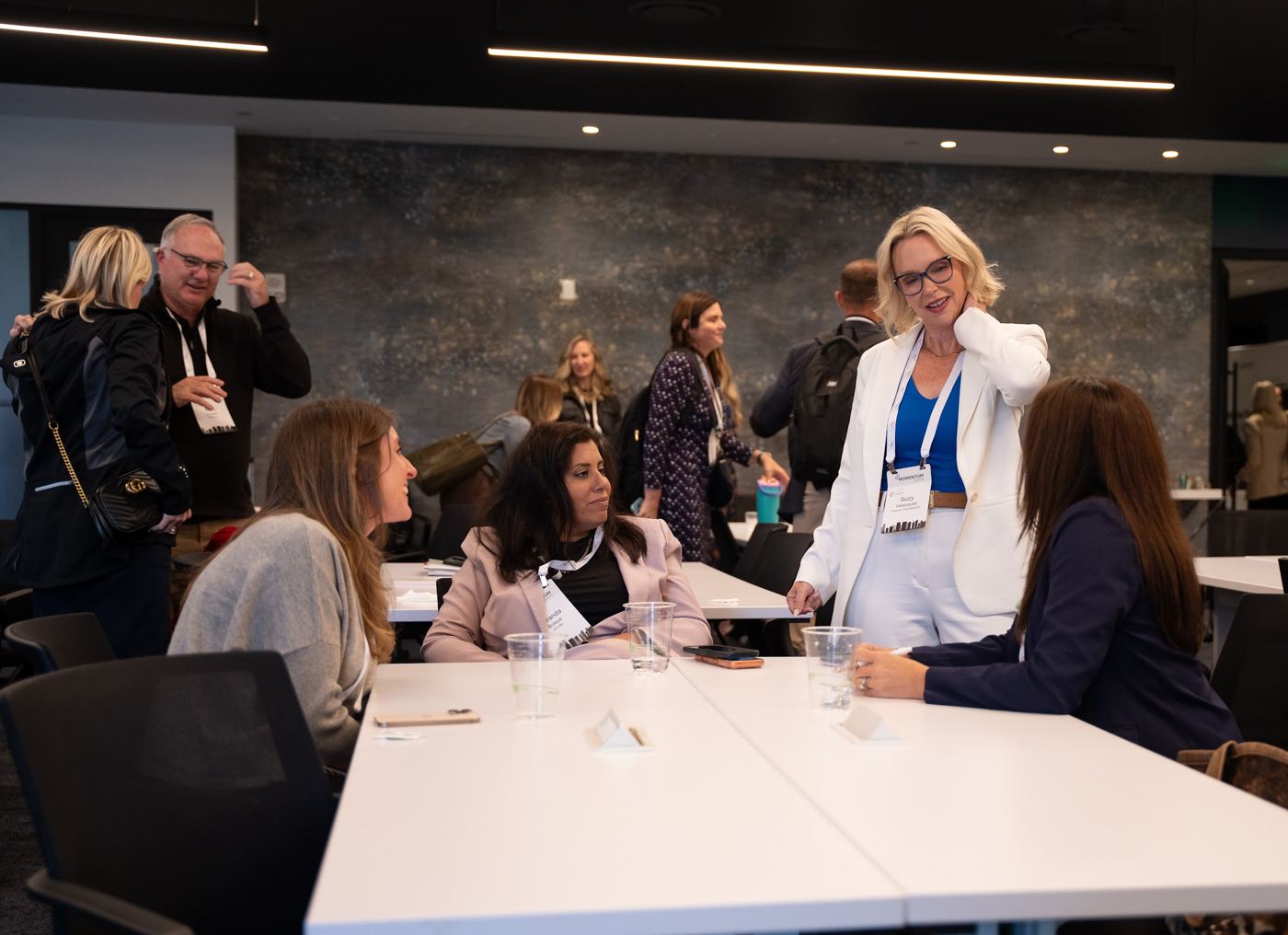 Attendees in conversation between sessions