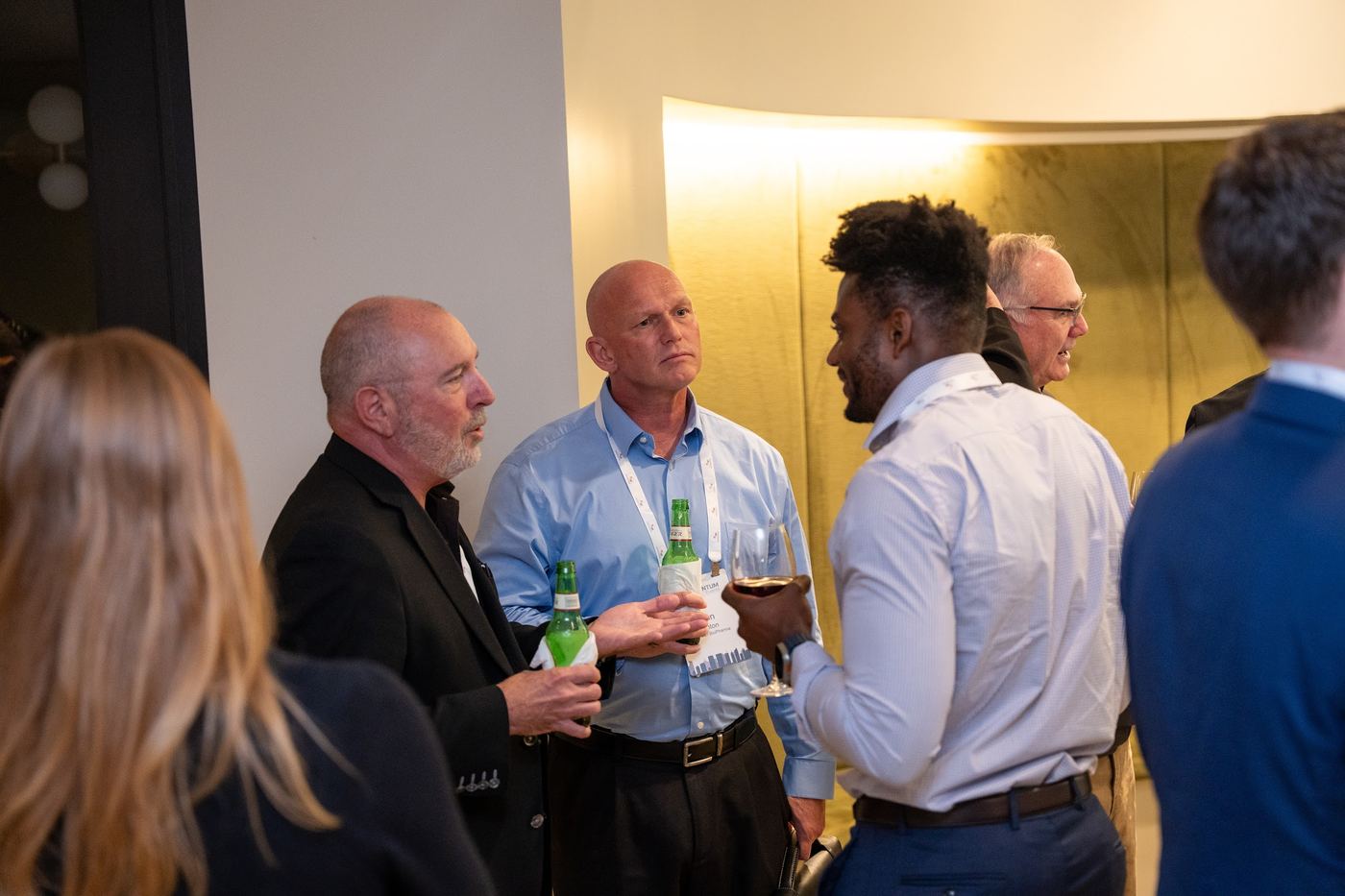 Attendees talking at the evening reception
