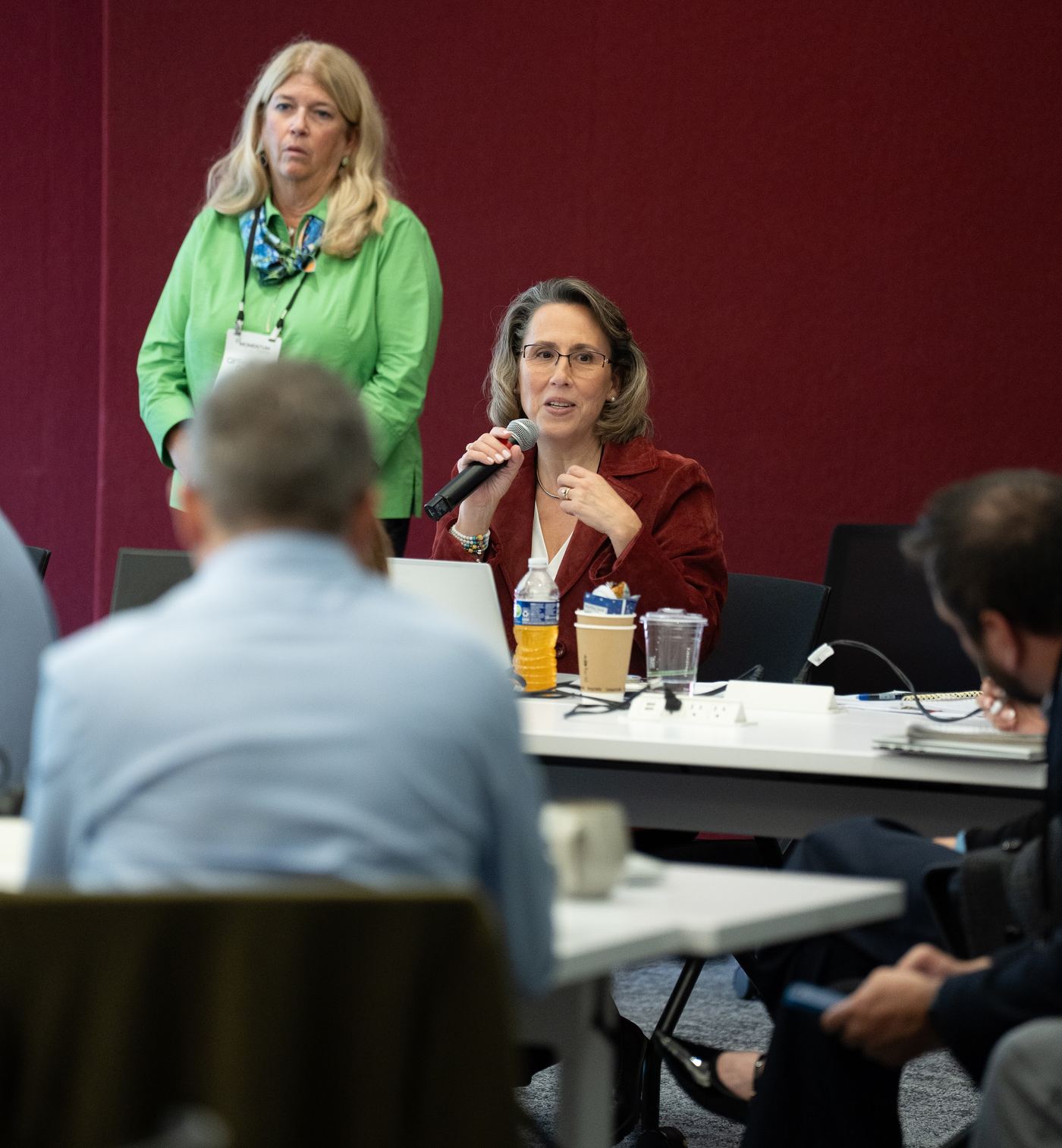 An attendee asking a question during a session